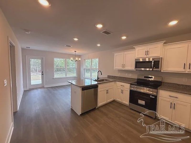 Furnished interior view inside a new home in Turtle Creek, Cantonment (Image 3).