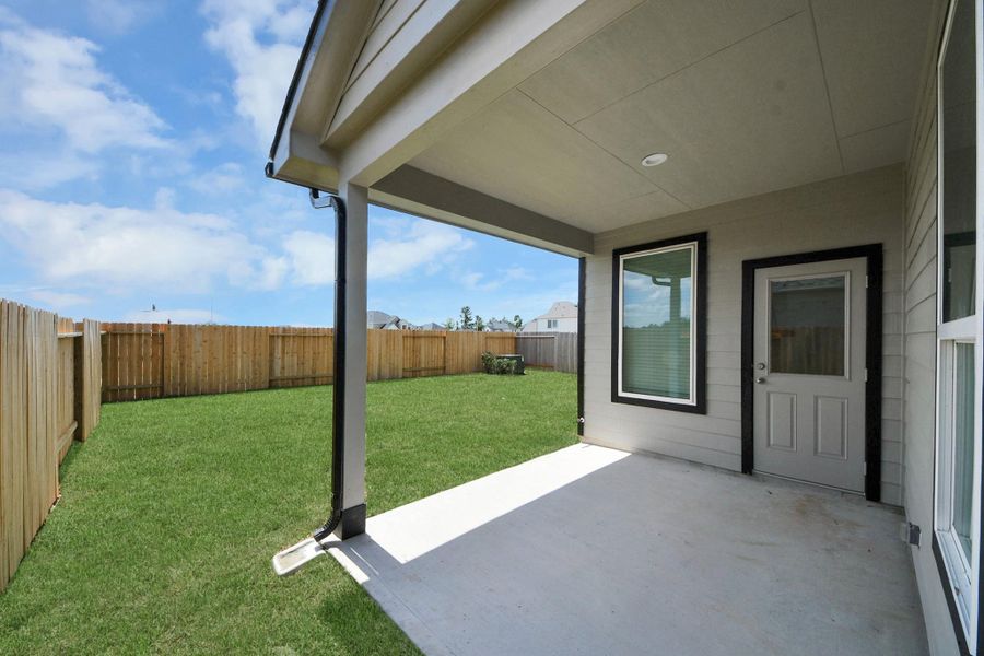 Experience outdoor living at its finest on this expansive covered patio, thoughtfully designed for BBQs and delightful outdoor dining.