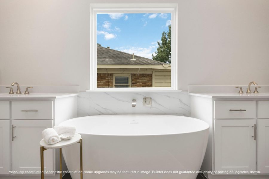 A close-up of the vessel bathtub offers a glimpse into tranquil moments waiting in the privacy of your ensuite retreat. A close-up of the vessel bathtub offers a glimpse into tranquil moments waiting in the privacy of your ensuite retreat.