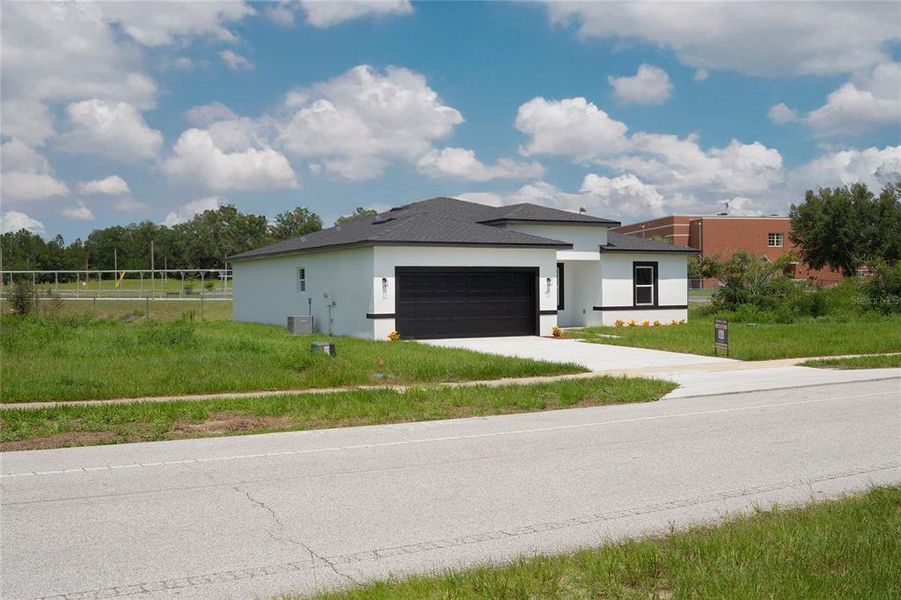 Front exterior of a new home in , Ocala, FL, highlighting curb appeal (Image 22).