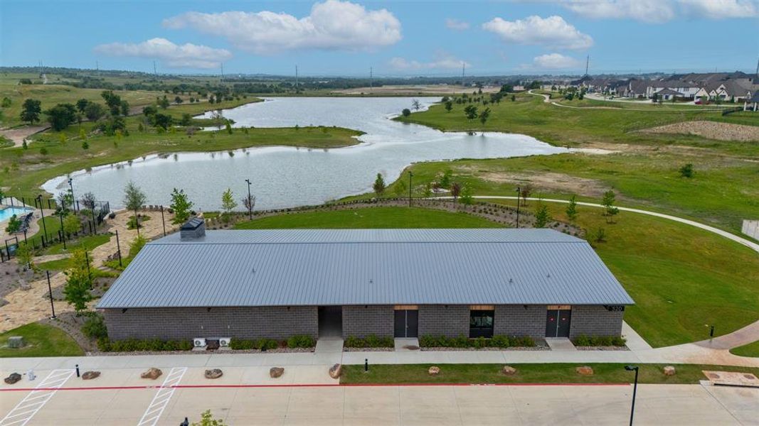 Contemporary community building featuring a metal roof, brick exterior, and multiple entryways Contemporary community building featuring a metal roof, brick exterior, and multiple entryways