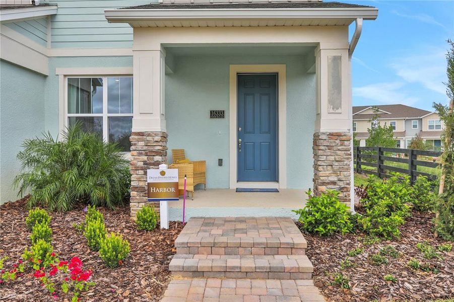 Front exterior of a new home in Hamlin Ridge, Winter Garden, FL, highlighting curb appeal (Image 23).