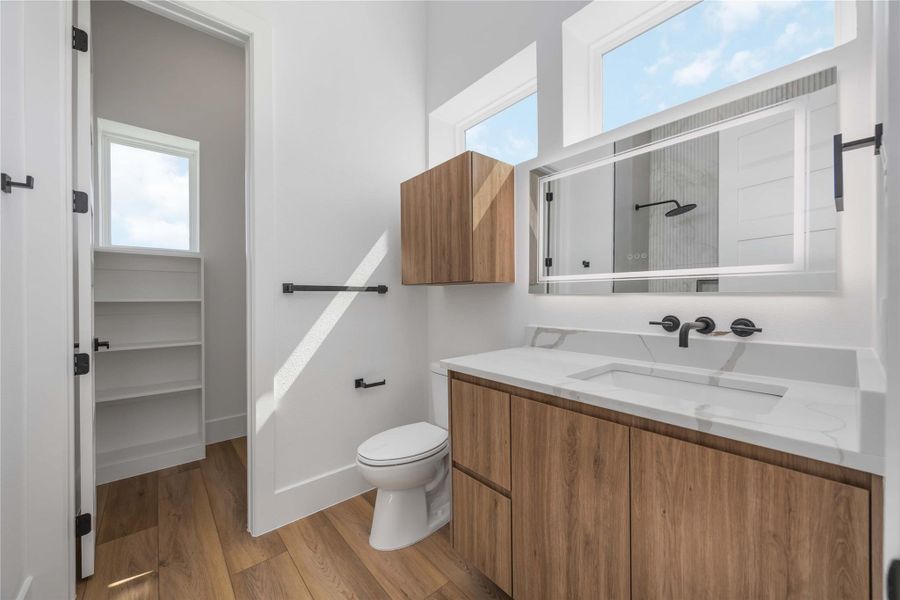 Ample storage in the secondary bathroom for optimal functionality.