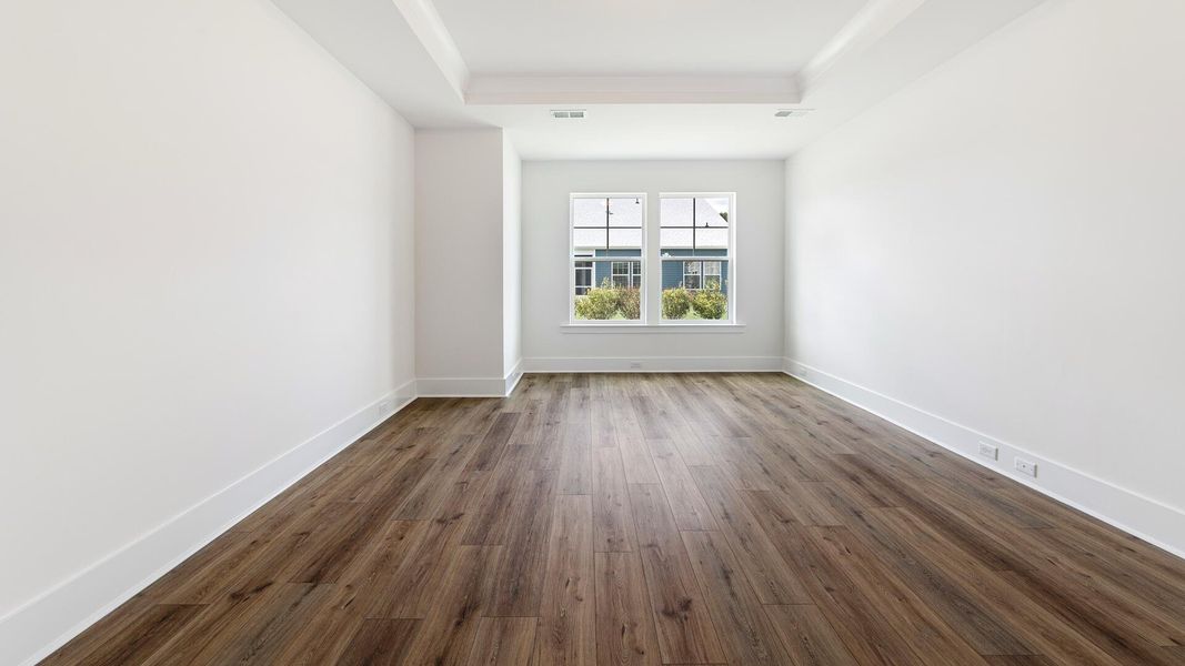 Spacious, unfurnished interior of a new home in Summerwind Crossing at Lakes of Cane Bay, Summerville (Image 10).