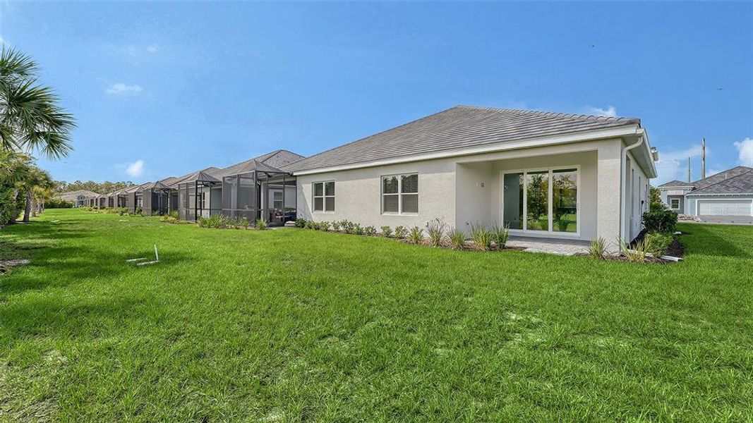 Exterior details and patio area of a home in Windward, Lakewood Ranch (Image 25).