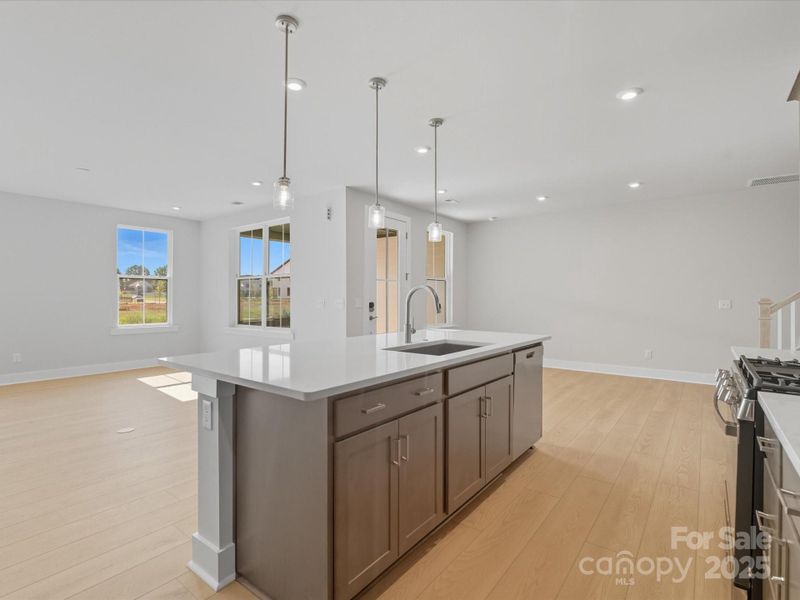 Large central island ideal for entertaining or casual dining.