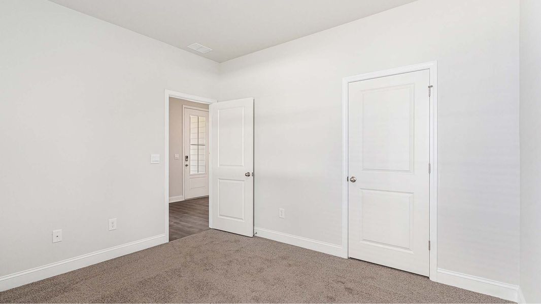 Representative unfurnished interior of a home built from the Covington by D.R. Horton in Eden Springs, Longs (Image 10).