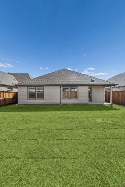 Covered Patio in the Heisman home plan by Trophy Signature Homes – REPRESENTATIVE PHOTO