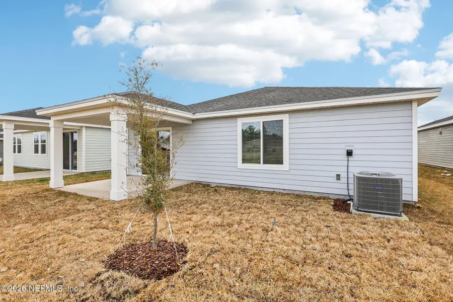 Exterior details and patio area of a home in Cypress Meadows - Signature Series, Jacksonville (Image 4).