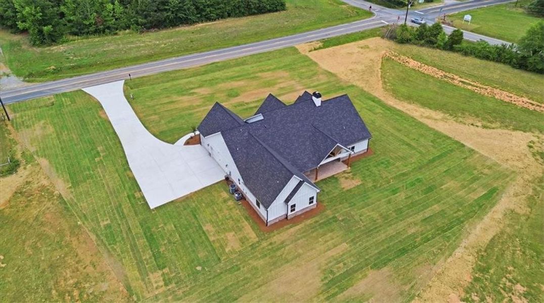 Front exterior of a new home in , Monroe, GA, highlighting curb appeal (Image 32).