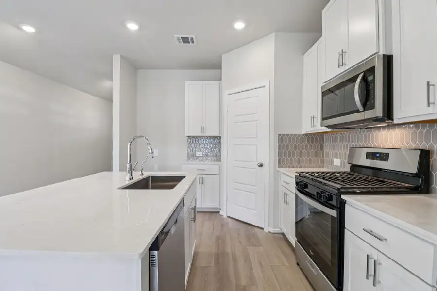 Furnished interior view inside a new home in , Conroe (Image 7). Furnished interior view inside a new home in , Conroe (Image 7).