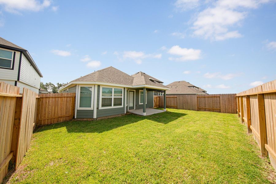 Exterior details and patio area of a home in Townsend Reserve, Splendora (Image 3).