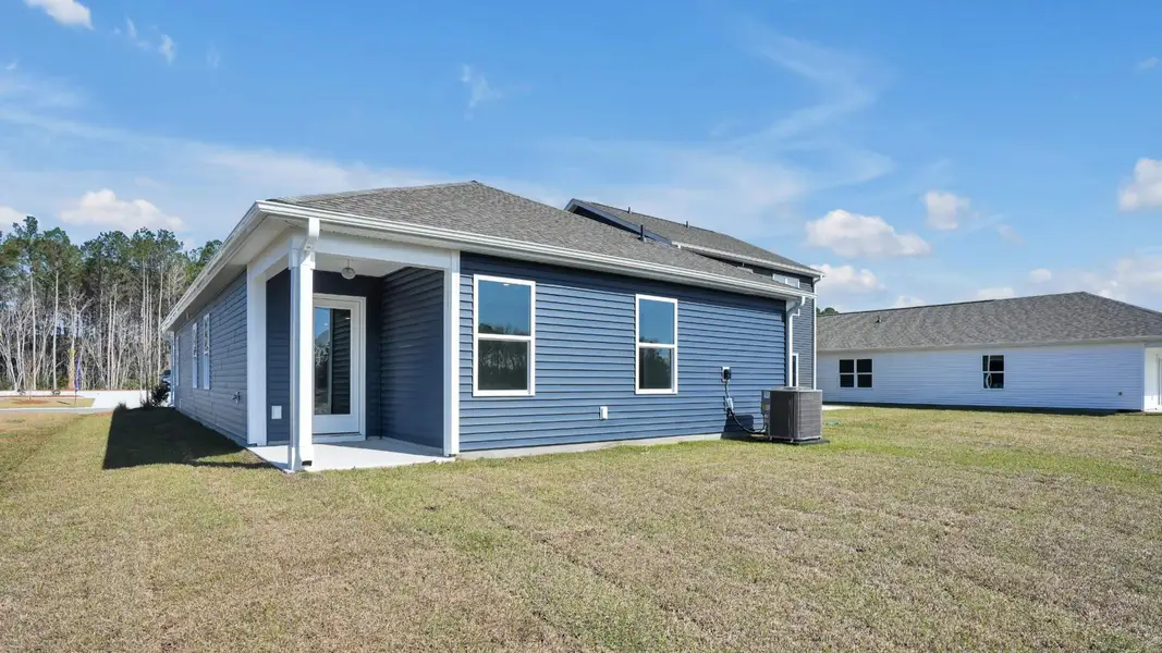 Exterior details and patio area of a home in Lockwood Landing, Supply (Image 3). Exterior details and patio area of a home in Lockwood Landing, Supply (Image 3).
