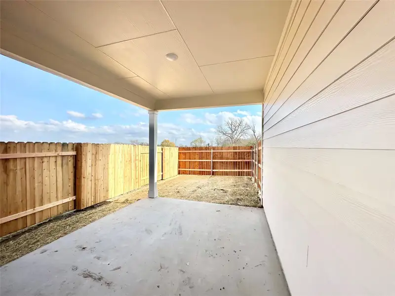 Fenced backyard with a patio Fenced backyard with a patio