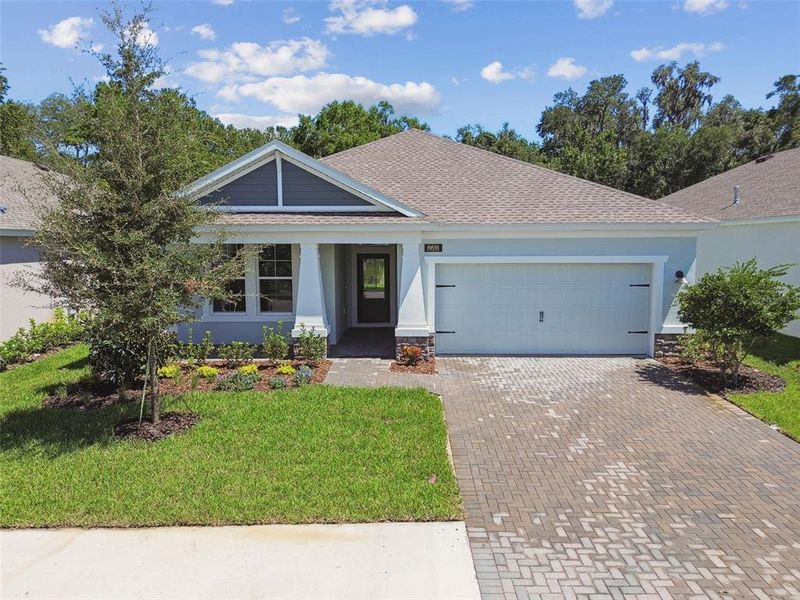 Front exterior of a new home in Cascades at Southern Hills, Brooksville, FL, highlighting curb appeal (Image 21).