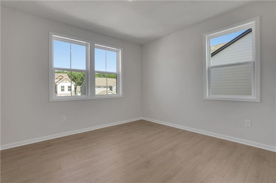 Spacious, unfurnished interior of a new home in The Paddocks at Doc Hughes, Buford (Image 19).