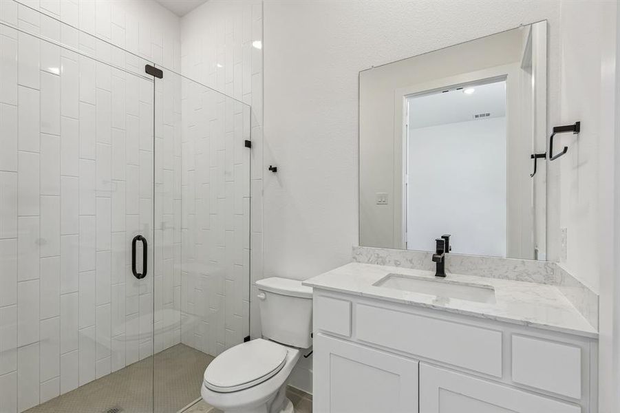 Guests will feel right at home in any of the beautifully finished guest baths our Justin plan has to offer.