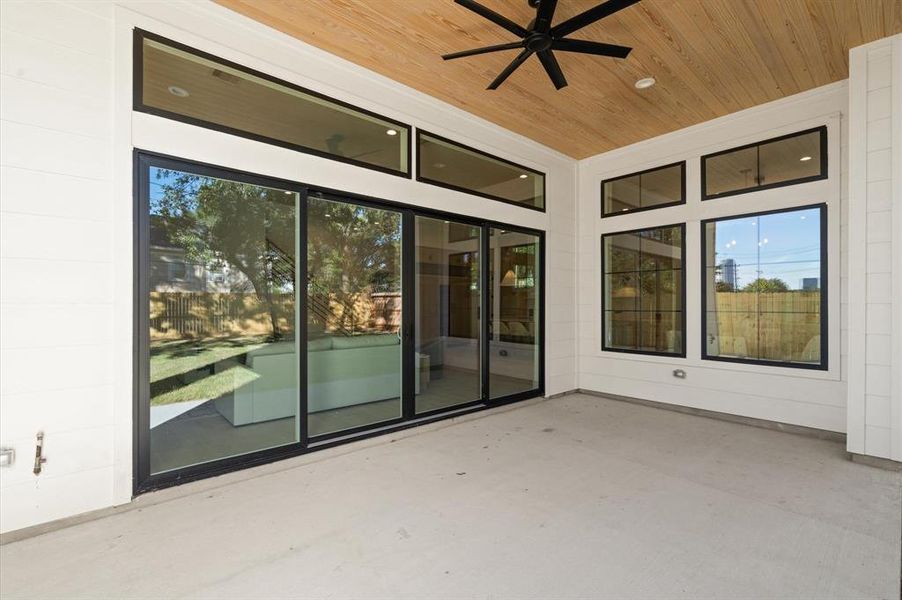 Backyard covered patio that is outdoor kitchen ready. Previous TOMO Homes project.