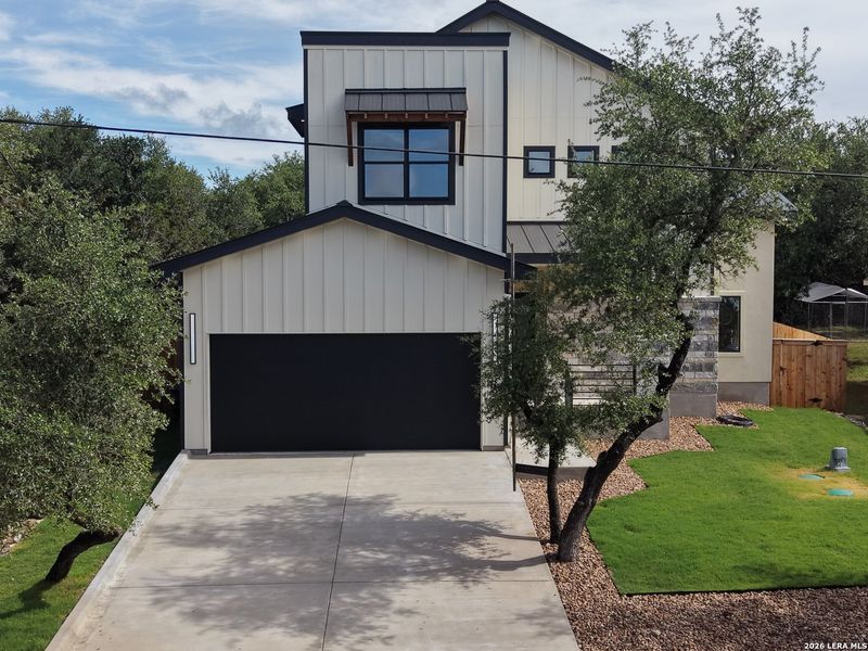 Front exterior of a new home in , Spring Branch, TX, highlighting curb appeal (Image 20).