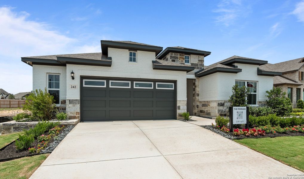 Front exterior of a new home in Stillwater Ranch, San Antonio, TX, highlighting curb appeal (Image 1).