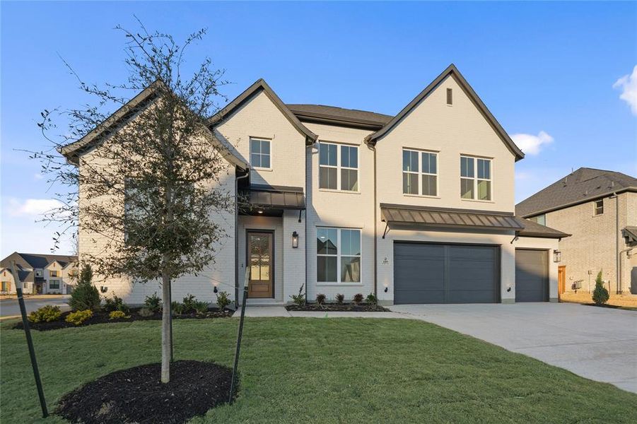 Front exterior of a new home in Light Farms Graham/Reagan, Celina, TX, highlighting curb appeal (Image 2). Front exterior of a new home in Light Farms Graham/Reagan, Celina, TX, highlighting curb appeal (Image 2).