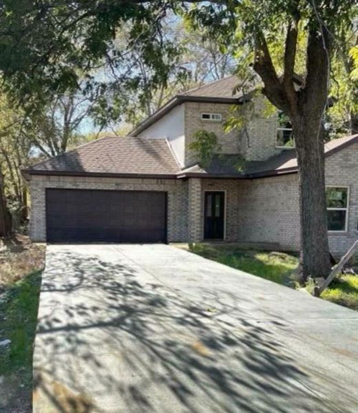 Front exterior of a new home in , Lancaster, TX, highlighting curb appeal (Image 1).