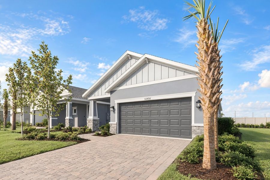 Front exterior of a new home in Lochside, Mount Dora, FL, highlighting curb appeal (Image 28).