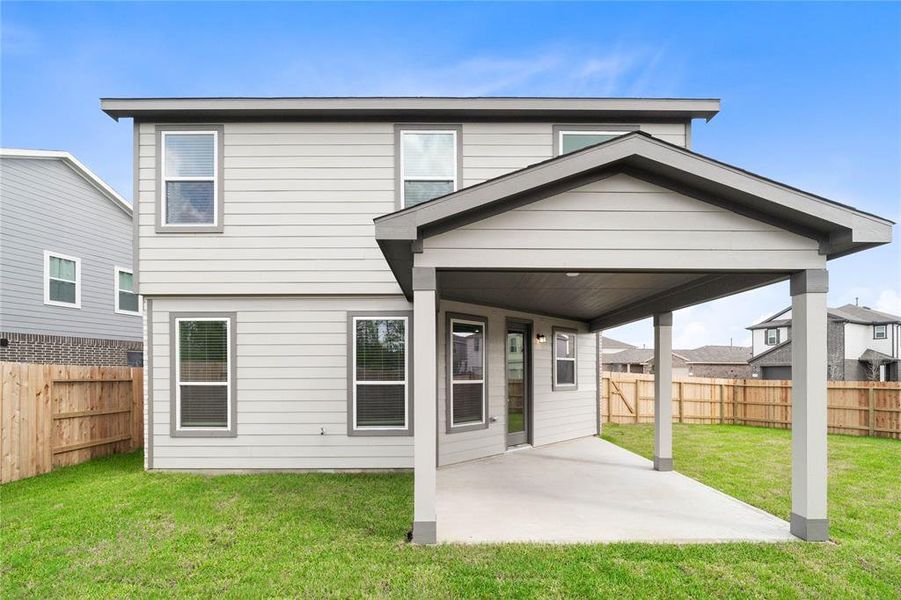 Come and see this spacious backyard with its beautiful covered patio. There is plenty of room for the kids to play and adults to relax!