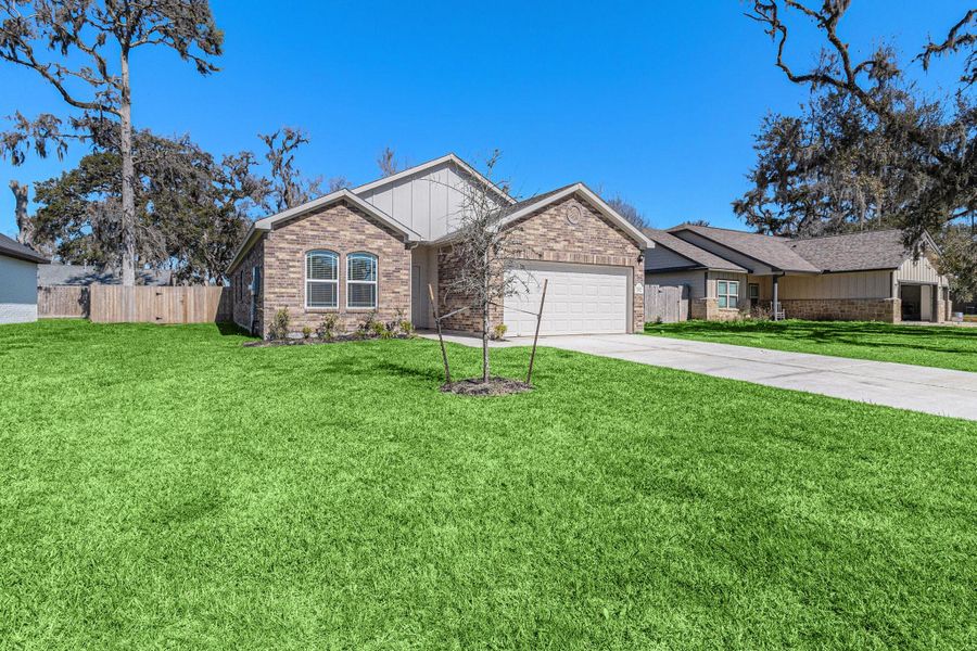 Front exterior of a new home in Columbia Lakes, West Columbia, TX, highlighting curb appeal (Image 1). Front exterior of a new home in Columbia Lakes, West Columbia, TX, highlighting curb appeal (Image 1).