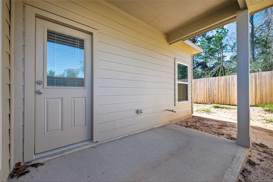 Exterior details and patio area of a home in Enclave at Willis, Willis (Image 3).
