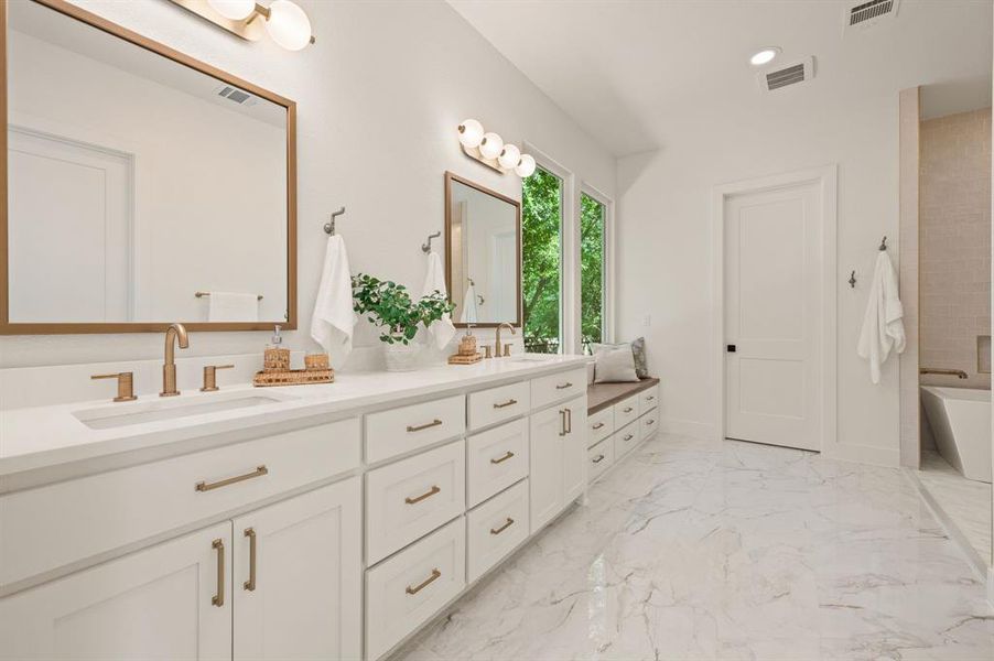 Bathroom featuring double vanity, marble tiled floors, a tub, recessed lighting, and a shower Bathroom featuring double vanity, marble tiled floors, a tub, recessed lighting, and a shower