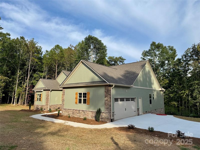 Front exterior of a new home in , Denton, NC, highlighting curb appeal (Image 17). Front exterior of a new home in , Denton, NC, highlighting curb appeal (Image 17).