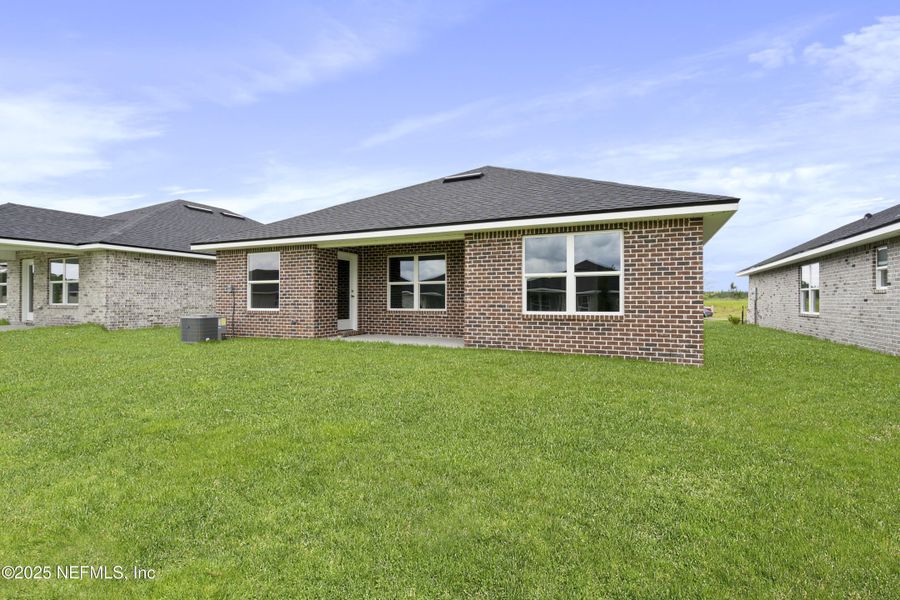 Front exterior of a new home in Shadow Crest at Rolling Hills, Green Cove Springs, FL, highlighting curb appeal (Image 15).