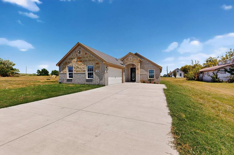 Front exterior of a new home in , Ferris, TX, highlighting curb appeal (Image 20).