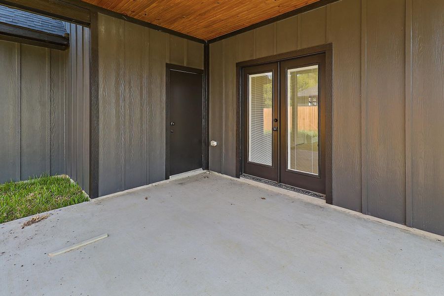 The secondary door leads to the downstairs half bath which is such a great feature to have bathroom access for your back porch.