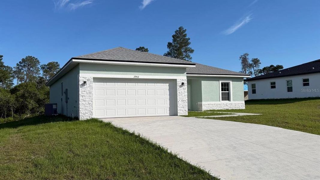 Front exterior of a new home in , Ocala, FL, highlighting curb appeal (Image 15).