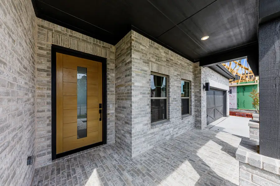 Representative exterior details of a home built from the 5042 by Tradition Homes in Lakewood at Brookhollow – 60′ Lots, Prosper (Image 3).