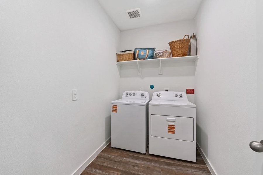 A LARGE laundry room with plenty of space to add a folding table or additional storage!