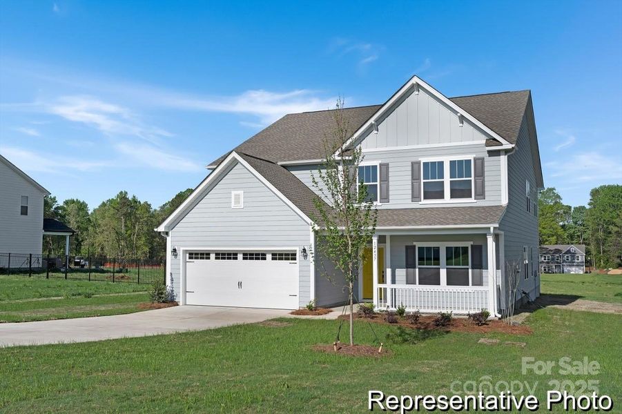 Front exterior of a new home in Whispering Hills, Locust, NC, highlighting curb appeal (Image 18).