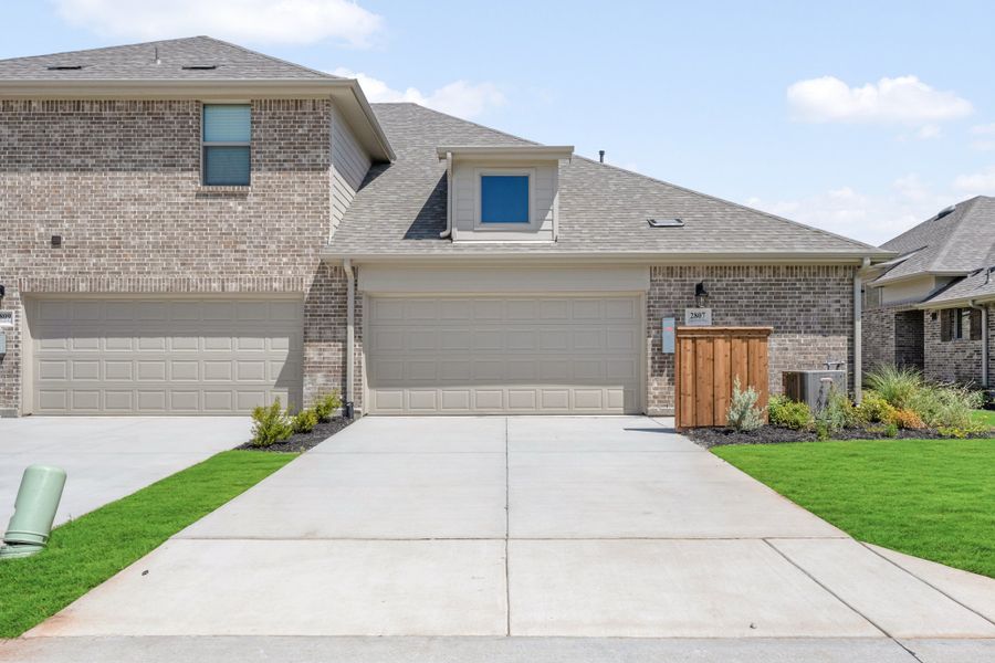 Front exterior of a new home in Woodbridge Villas, Wylie, TX, highlighting curb appeal (Image 29).