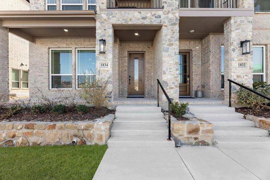 Exterior details and patio area of a home in The Abbey at Mercer Crossing, Farmers Branch (Image 3).