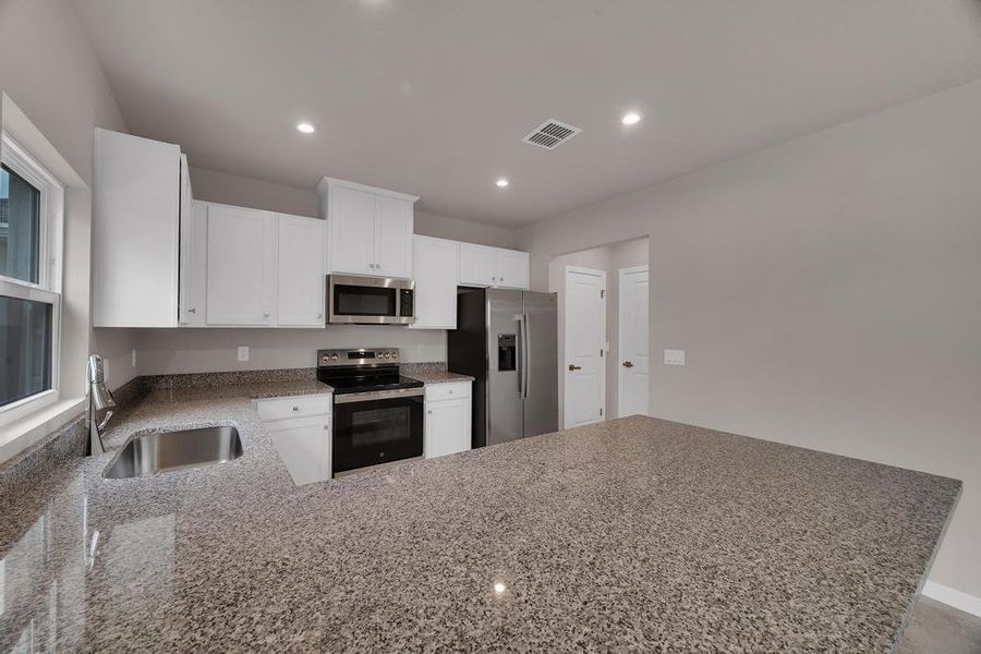 Furnished interior in a model home at Terra Lago in Indiantown (Image 8).