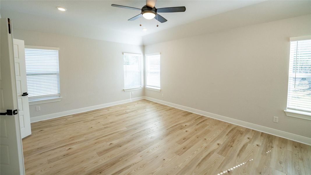 Unfurnished room with light wood finished floors, recessed lighting, and ceiling fan Unfurnished room with light wood finished floors, recessed lighting, and ceiling fan