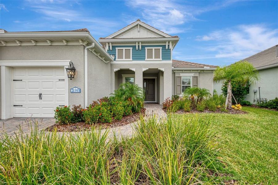 Front exterior of a new home in , Venice, FL, highlighting curb appeal (Image 27).
