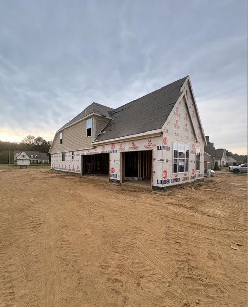 New construction featuring a gable roof, vinyl siding, and multiple window placements New construction featuring a gable roof, vinyl siding, and multiple window placements