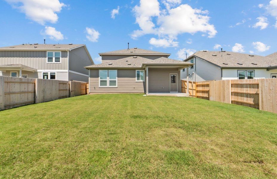 Front exterior of a new home in Patterson Ranch, Georgetown, TX, highlighting curb appeal (Image 15). Front exterior of a new home in Patterson Ranch, Georgetown, TX, highlighting curb appeal (Image 15).