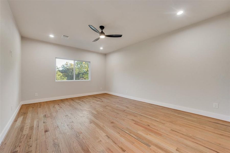 Spare room featuring light hardwood / wood-style floors and ceiling fan