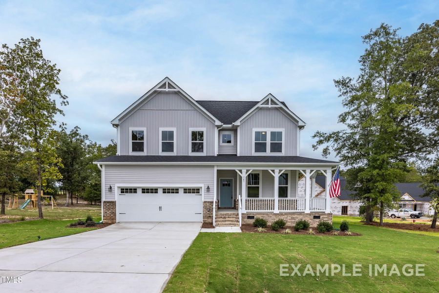 Front exterior of a new home in Tobacco Road, Angier, NC, highlighting curb appeal (Image 32). Front exterior of a new home in Tobacco Road, Angier, NC, highlighting curb appeal (Image 32).