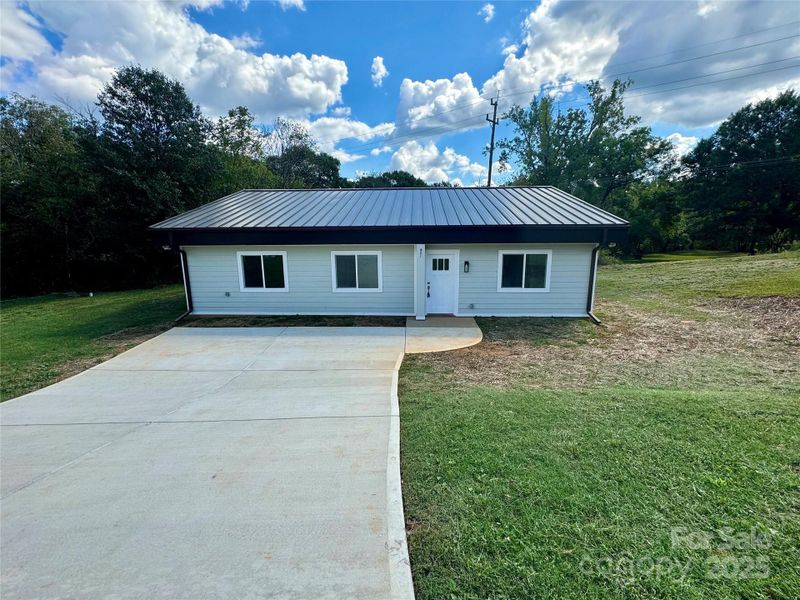 Front exterior of a new home in , Shelby, NC, highlighting curb appeal (Image 4).