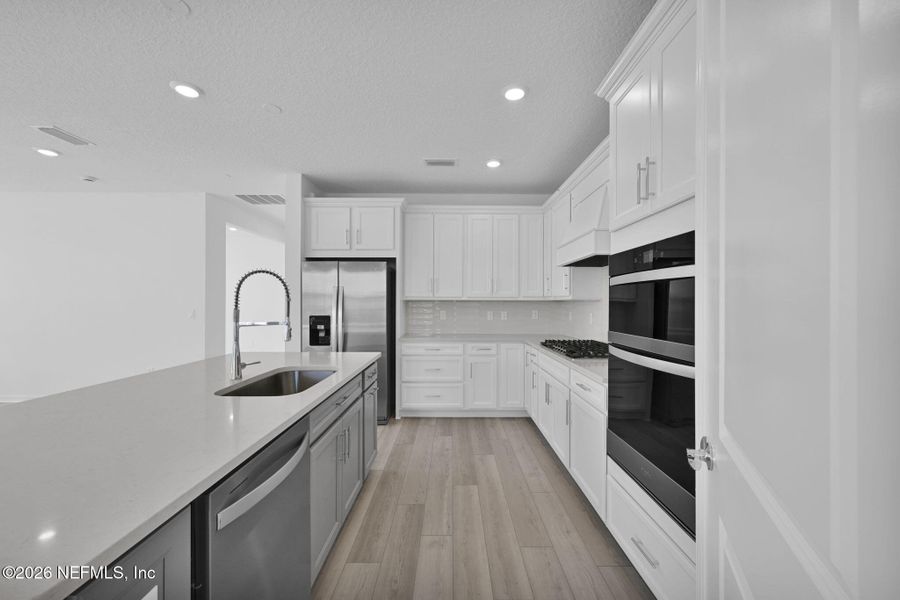 Furnished interior view inside a new home in Del Webb Wildlight, Yulee (Image 8).